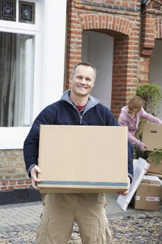Flat removals in Maidavale with moving boxes in an apartment hallway