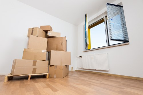 Professional movers handling office furniture in Maidavale