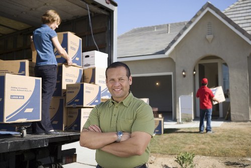 Professional movers handling boxes for a Maidavale relocation