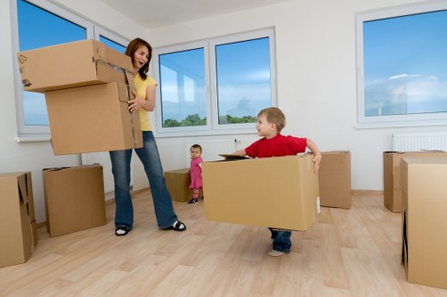 Local moving team loading boxes in a West London street