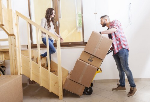 Trained staff preparing equipment for a house move