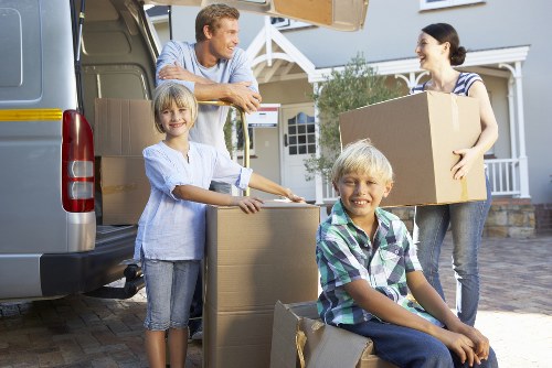 Packed boxes and furniture ready for flat removals in Maidavale