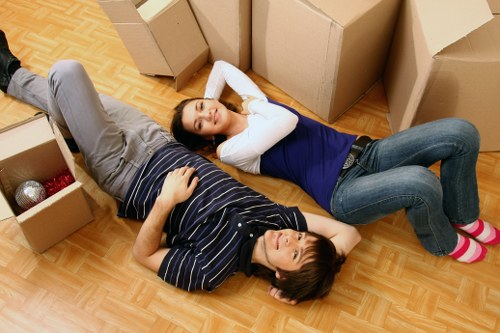 Local moving team handling furniture through a Maida Vale apartment building