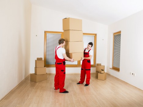 Unpacking service arranging boxes into rooms after a move in Maida Vale