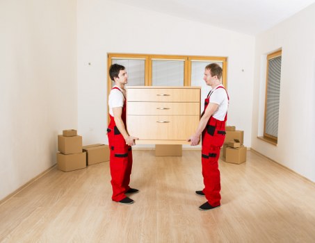 Professional movers loading furniture for a Maidavale home relocation